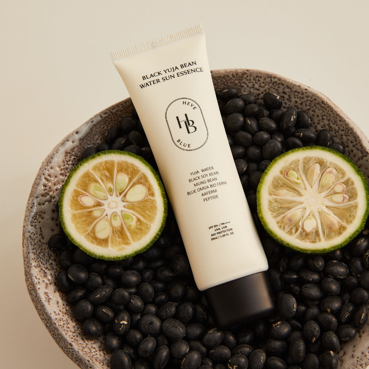 HEVEBLUE Black Yuja Bean Water Sun Essence SPF50+ PA++++